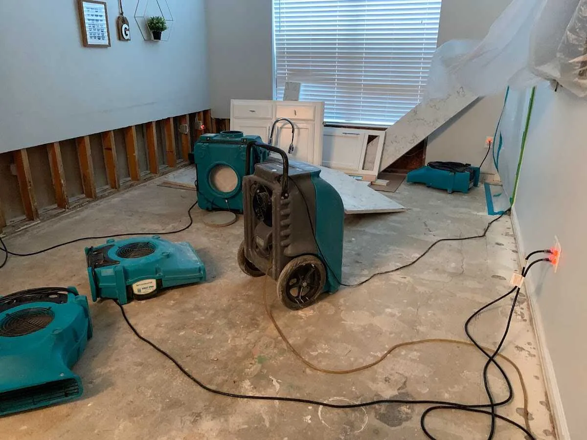 Dehumidifier in flood-cut room for Water Damage Restoration in White Center
